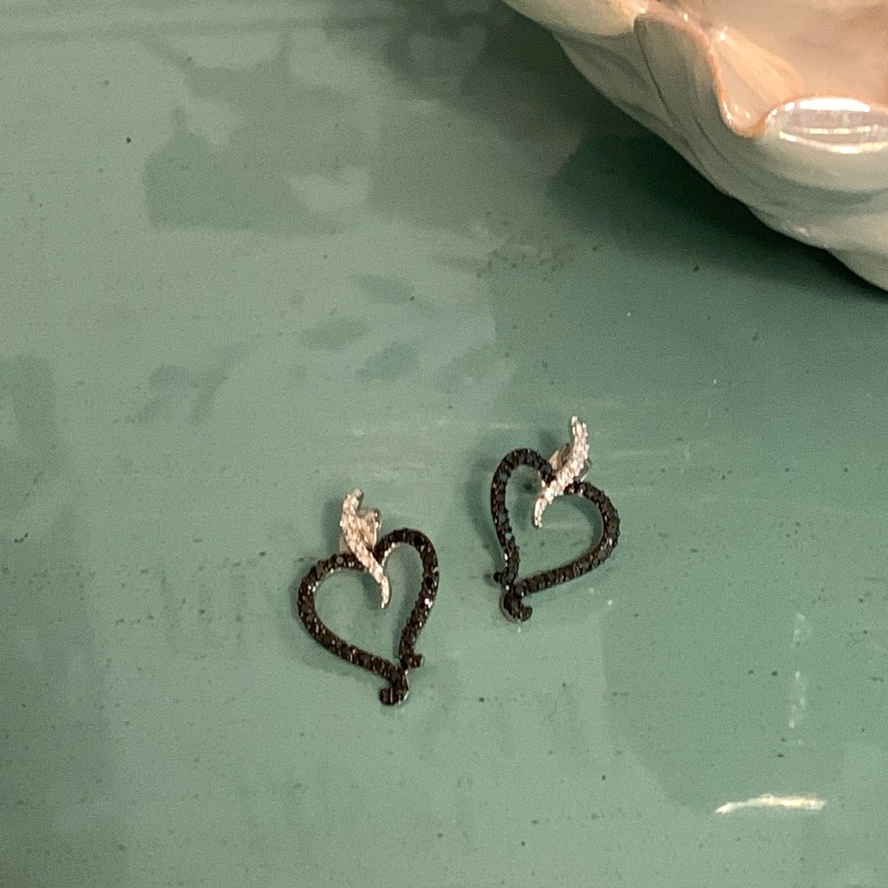 Black sparkly heart earrings.